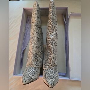 Evander boots by Madden Girl. Snakeskin Pattern Heeled Boots
